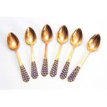 A SET OF SIX MID 20TH CENTURY SILVER GILT AND ENAMEL SPOONS. Stamped with hammer and sickle inside a
