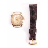 WINEGARTENS, LONDON E.C. 2. A GENTLEMANS VINTAGE 9CT GOLD WRIST WATCH the tank shaped case enclosing