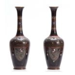 A PAIR OF EARLY 20TH CENTURY CLOISONNE VASES decorated with birds and geometric designs 25cm high.
