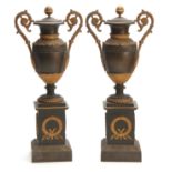A PAIR OF REGENCY BRONZE AND ORMOLU ADAM STYLE URNS / CANDLEHOLDERS having reversible tops and