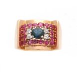 A STYLISH YELLOW GOLD GENTLEMANS TUTTI FRUTTI DRESS RING the dished top set with a band of rubies,