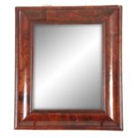 A LARGE WILLIAM AND MARY D SHAPED WALNUT HANGING MIRROR with bevelled mirror plate 69cm wide 78cm