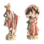 A PAIR OF LATE 19TH CENTURY ROYAL DUX BOHEMIAN STANDING FIGURES of a standing classical Lady and