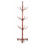 A LATE GEORGIAN THREE TIER MAHOGANY COAT AND HAT STAND with curved hooks and tapering ring turned