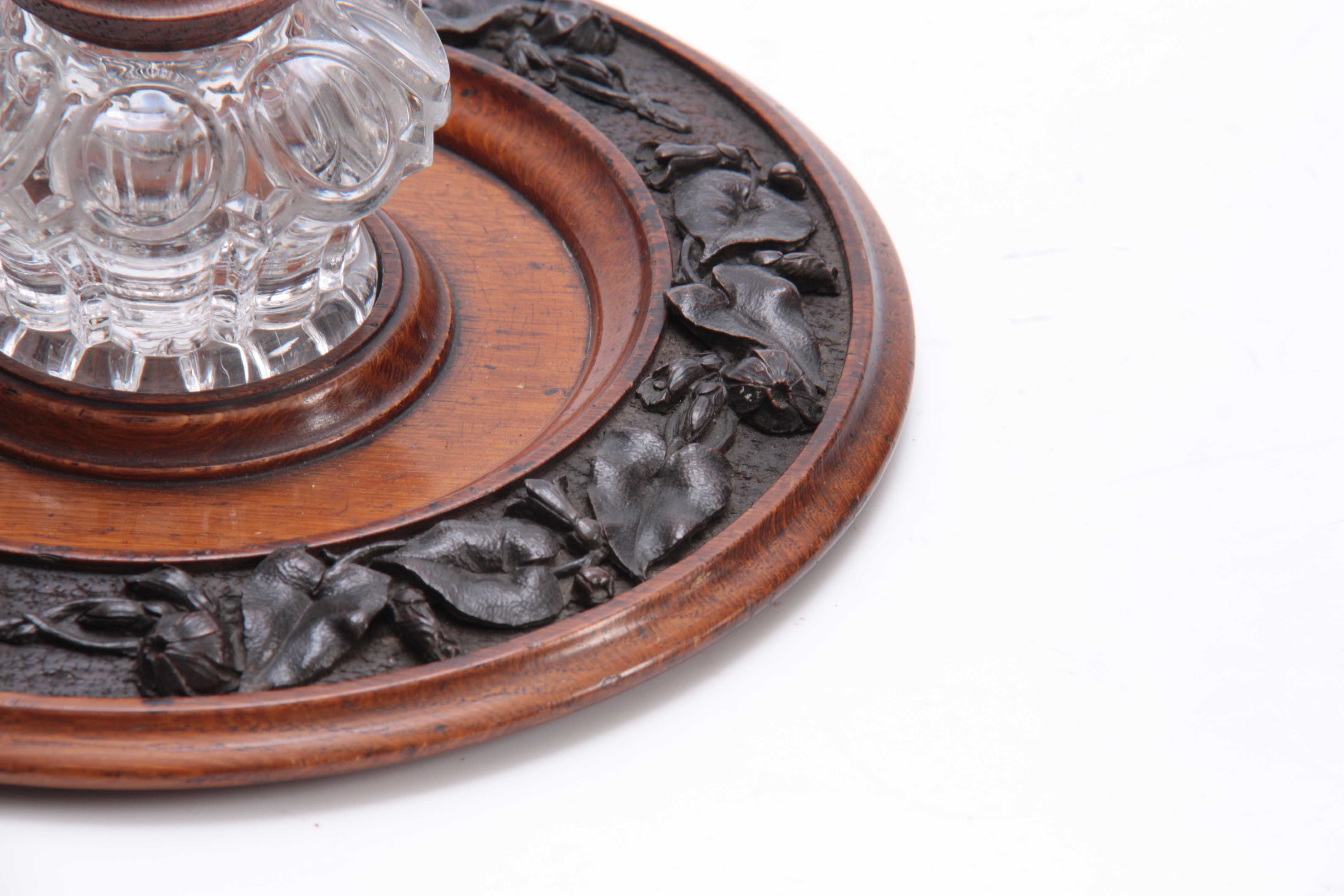 A 19TH CENTURY CARVED OAK CIRCULAR INK STAND with cut glass inkwell to the centre having a floral - Image 3 of 5