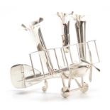 A CHROME ART DECO NOVELTY TRIO POSY VASE modelled as a biplane with three removable fluted vases,