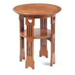 A LIBERTY STYLE ARTS AND CRAFTS OAK OCCASIONAL TABLE having a circular top with kingwood