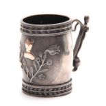 AN UNUSUAL 19TH CENTURY CONTINENTAL SILVER METAL MARRIAGE MUG with cast leaf work rims enclosing