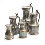 A MATCHED SET OF FIVE 18th CENTURY PEWTER TAPPIT HENS having hinged lids and double acorn thumb