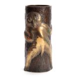 A JAPANESE MEIJI PERIOD BRONZE VASE modelled as a polished bronze bear holding a patinated