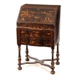 AN EDWARDIAN QUEEN ANNE STYLE CHINOISERIE LACQUERED BUREAU ON STAND the angled fall revealing a