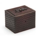 A 19TH CENTURY BLACK FOREST HATCHED CARVED WOOD TEA CADDY with carved fruit to the ribbed top 14cm