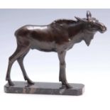 A PATINATED BRONZE SCULPTURE OF A STANDING MOOSE on clipped veined marble base - lacking antlers.