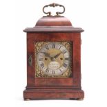 W JACKSON. LONDON A SMALL WILLIAM AND MARY STYLE WALNUT BRACKET CLOCK having an inverted bell top