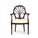 A 19TH CENTURY HEPPLEWHITE STYLE OPEN ARMCHAIR / DESK CHAIR having an oval-shaped feather crested