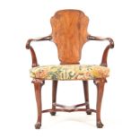 A GEORGE I WALNUT OPEN ARMCHAIR with solid vase-shaped splat back and shaped scrolled top rail,