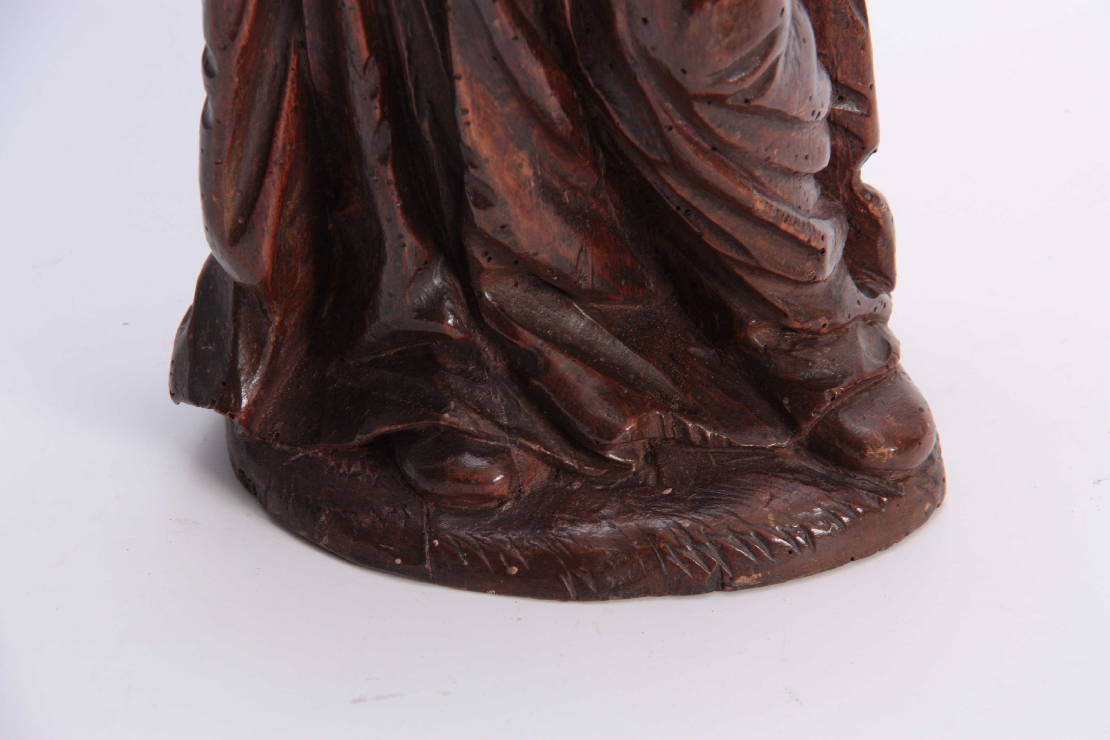 A 17TH CENTURY CARVED LIMEWOOD FIGURE OF A SAINT finely carved with a good patination 48cm high. - Image 4 of 5