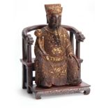 A 19TH CENTURY ORIENTAL SEATED CARVED WOOD BUDHA with finely carved gilt scrollwork costume and