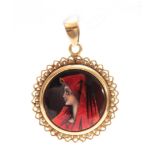 AN 18CT YELLOW GOLD MOUNTED RED LIMOGES ENAMEL PORTRAIT PENDANT OF A YOUNG ART NOUVEAU LADY