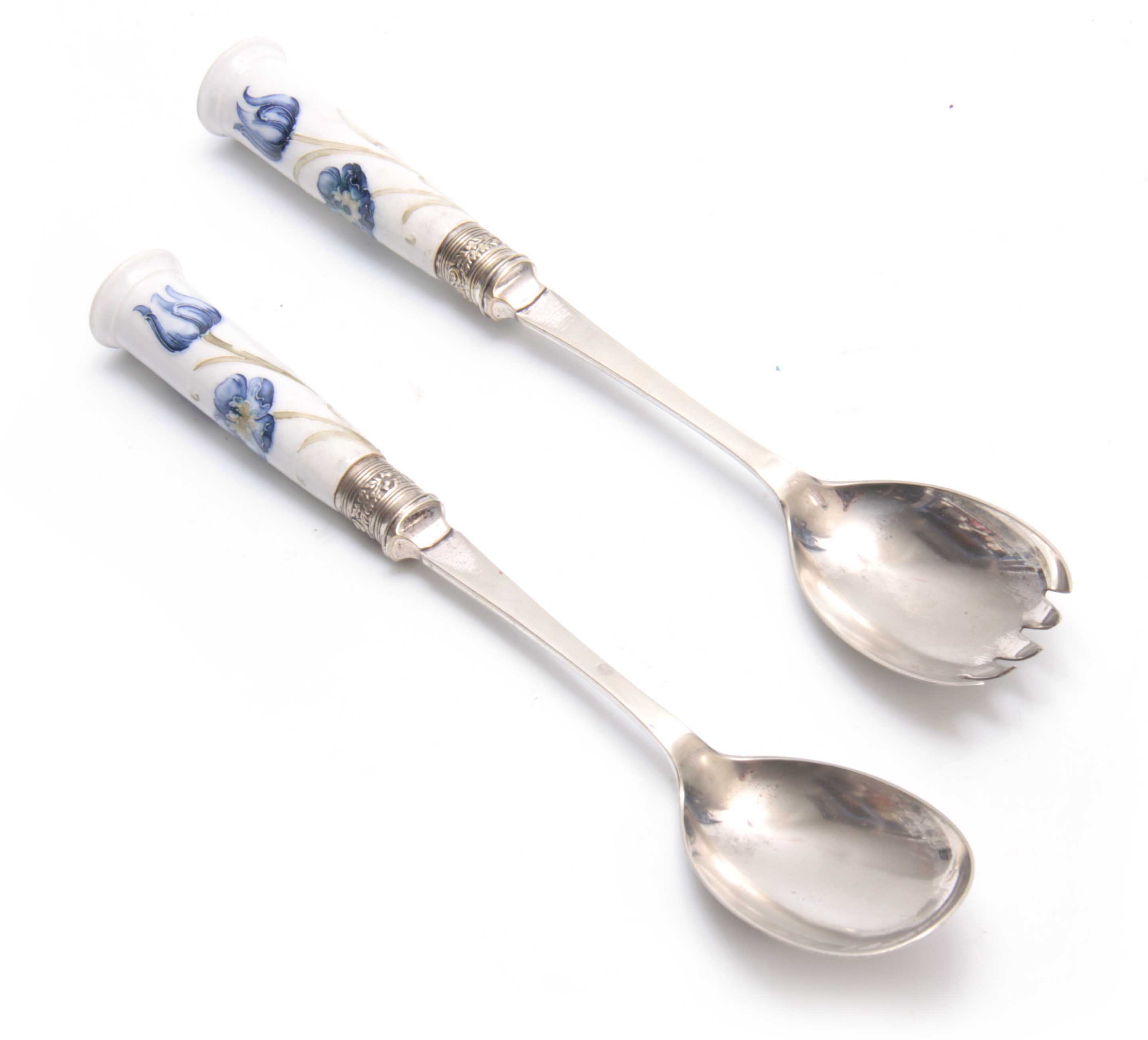 A PAIR OF SILVER PLATED MACINTYRE MOORCROFT FLORIANWARE SALAD SERVERS with blue flower and leaf