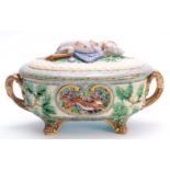 A 19TH CENTURY MINTON MAJOLICA GAME PIE DISH AND COVER the oval two-handled body on paw feet