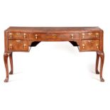 A 19TH CENTURY QUEEN ANNE STYLE FIGURED WALNUT SERPENTINE FRONTED DESK with a short-grained