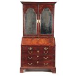 A WILLIAM AND MARY BURR WALNUT BUREAU BOOKCASE having rich colour and patination, the flat top