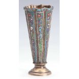 A RUSSIAN SILVER GILT AND ENAMELLED FOOTED FLUTED TAPERING VASE with colourful bead edged scrolled