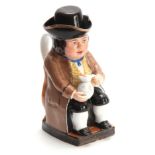 A LATE 19THCENTURY HARD PORCELAIN TOBY JUG the well dressed seated figure wearing a brown coat and