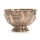 A LARGE CHINESE SILVER BOWL with gilt interior having embossed foliate panels depicting birds,