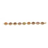 A 9CT GOLD FILIGREE MULTI-COLOURED STONES BRACELET 17.5cm across