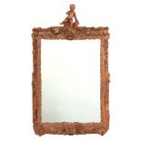 AN 18TH CENTURY CONTINENTAL FINELY CARVED OAK HANGING MIRROR with rococo shaped leaf carved frame