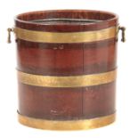 A GEORGE III MAHOGANY CIRCULAR BRASS BOUND PEAT BUCKET with ringed brass hoops and side carrying