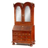 A WILLIAM AND MARY HERRING-BANDED AND FIGURED WALNUT BUREAU BOOKCASE the double-domed top with