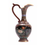 AN ORIENTAL CLOISONNE ENAMEL FLATTENED OVOID EWER WITH SLENDER NECK finely decorated with floral