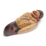 A BLACK FOREST POLYCHROME CARVED WOOD COAT HOOK depicting a humorous figure 19cm high