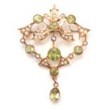 A FINELY MADE 9CT GOLD PERIDOT AND PEARL SET BROOCH - hallmarked 9ct gold 3.5cm wide 4.5cm overall.