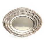 A SET OF THREE GRADUATED SILVER MEAT DISHES with scalloped edge feathered borders, engraved with