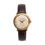 JAEGER-LECOULTRE, FABRIQUE EN SUISSE. A GENTLEMANS 1950's 18CT GOLD WRIST WATCH on crocodile leather