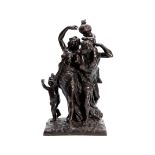 AFTER CLODION A LATE 19TH CENTURY CENTURY PATINATED BRONZE GROUP "The Triumph of Bacchus" on a