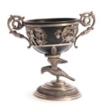 A 19TH CENTURY SILVER METAL CHALICE with parrot cast base and flared foot 20cm