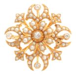 A 15CT YELLOW GOLD DIAMOND SET AND SEED PEARL FLOWERHEAD BROOCH of openwork design with raised