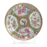 A 19TH CENTURY CIRCULAR CHINESE CANTON PLATE decorated with panels of figures in garden settings and