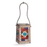 A LATE VICTORIAN GOTHIC STYLE STAINED GLASS BRASS HALL LANTERN with coloured panels and shaped