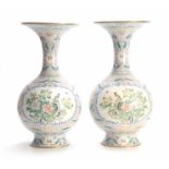 A LARGE PAIR OF CHINESE BULBOUS CLOISONNE VASES WITH SLENDER FLARED NECKS decorated with panels on a