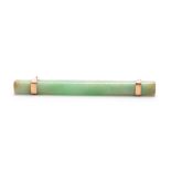 A JADE AND GOLD MOUNTED BAR BROOCH 7cm wide.