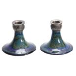 A PAIR OF MOORCROFT MOONLIT BLUE TAPERING CIRCULAR BASE CANDLESTICKS WITH TUDIC PEWTER SCONCES