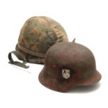 TWO SECOND WORLD WAR ARMY HELMETS, the camouflage example American, the other German