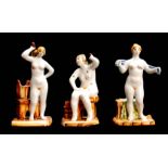 A GROUP OF THREE RUSSIAN GLAZED TERRACOTTA NUDE FEMALE BATHERS 19cm high and smaller