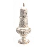 A VICTORIAN BALUSTER SILVER SUGAR CASTOR with all over embossed rococo decoration 15.5cm high